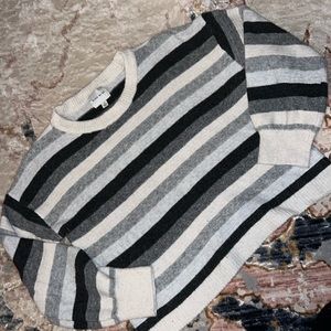 Oversized short sweater (not cropped, past bellybutton but can’t tuck in)